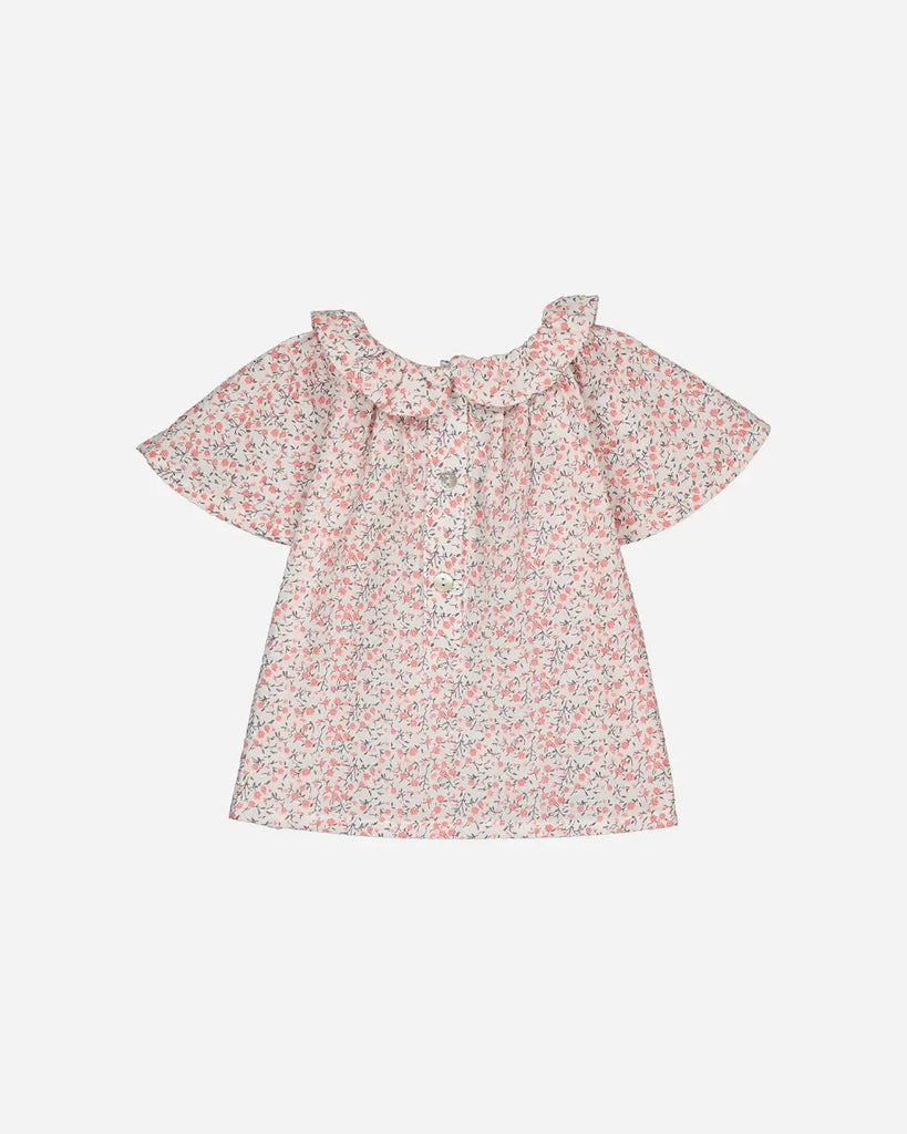 Vue de dos de la blouse pour bébé fille à imprimé fleurs de cerisier de la marque Bobine Paris.