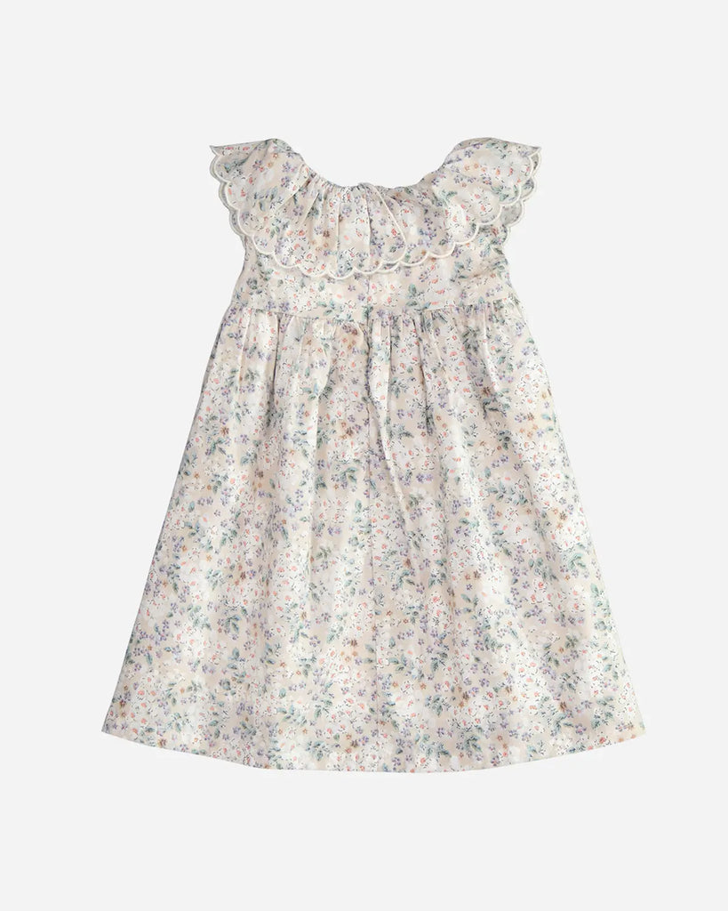 Vue de dos de la robe pour bébé fille beige à motif fleuri et col bordé de la marque Bobine Paris.