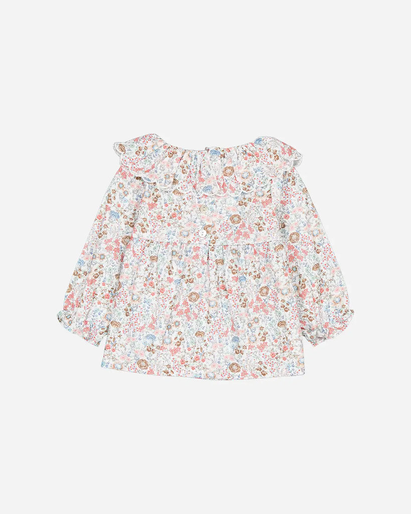 Vue de dos de la blouse pour bébé fille à col volanté et à fleurs colorées de la marque Bobine Paris.