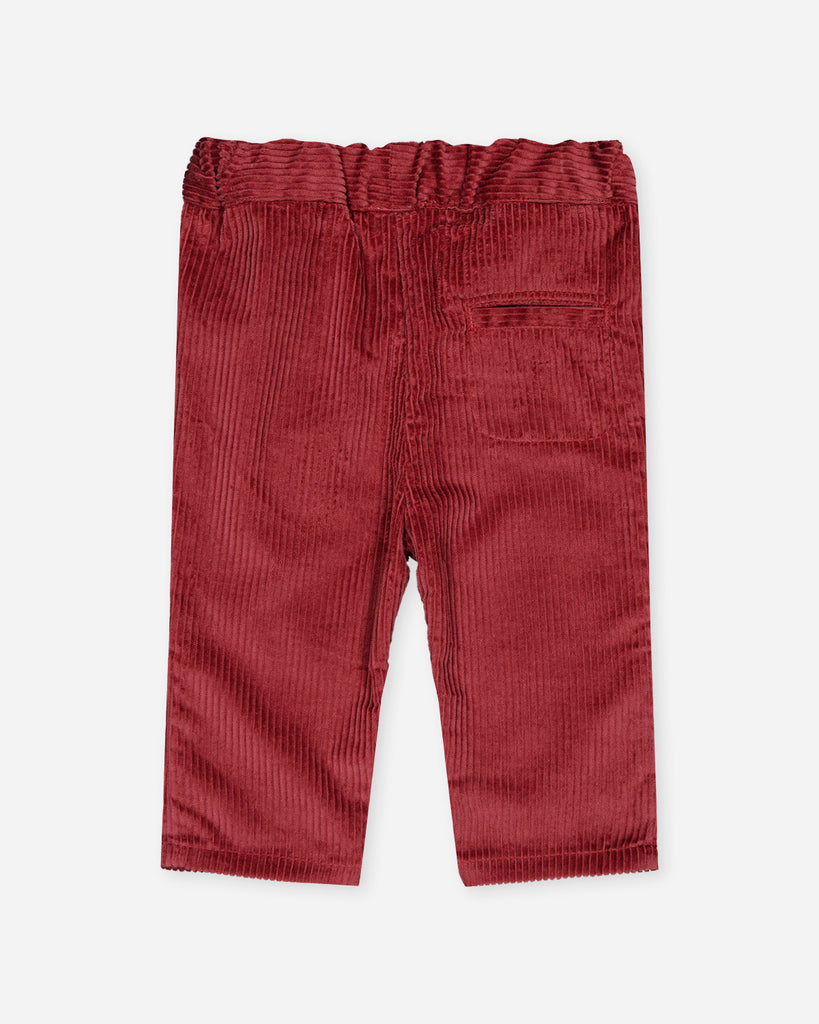 Vue de dos du pantalon en velours côtelé rouge brique avec une poche au côté droit de la marque Bobine Paris.