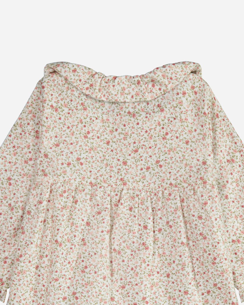 Zoom sur le col claudine de la blouse ava fleurie rouge vue de dos.