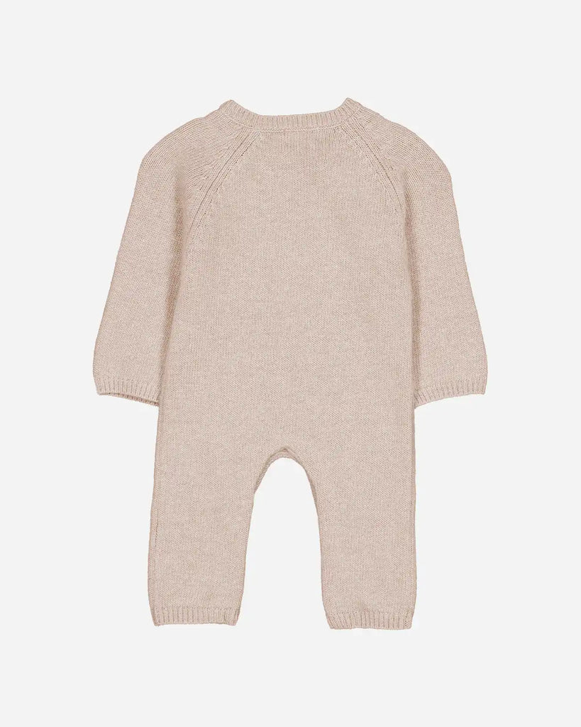 Vue de dos de la combinaison pour bébé en laine et cachemire beige clair de la marque Bobine Paris.