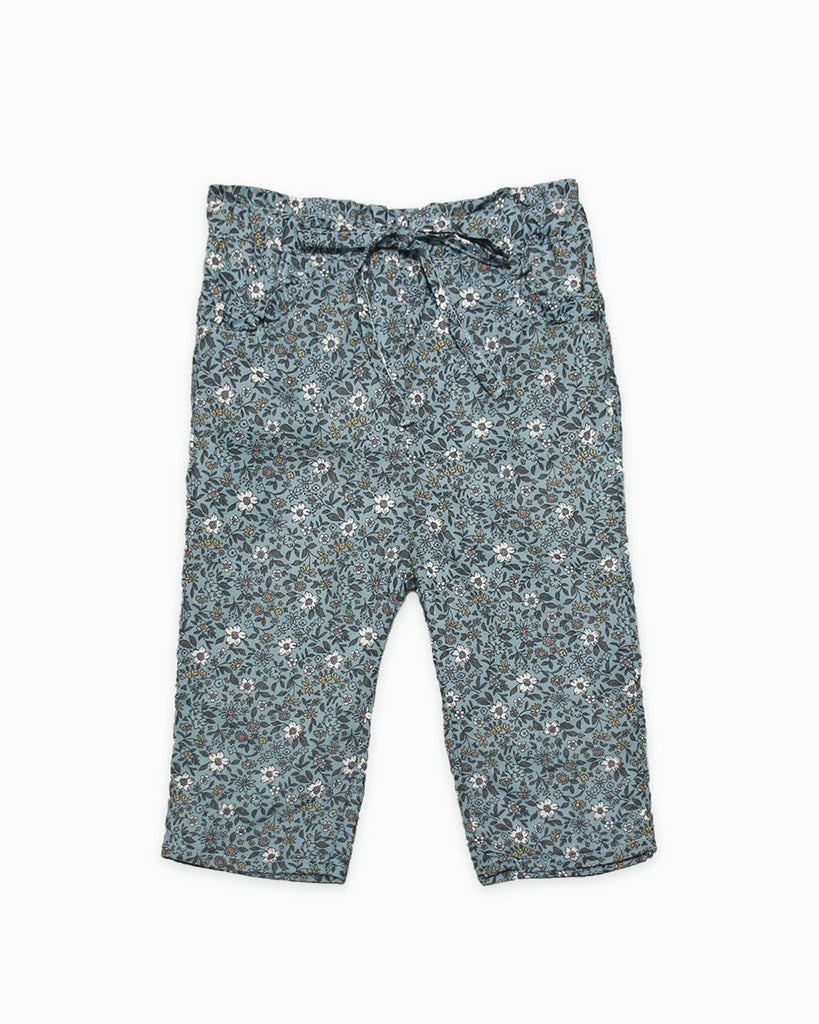 Pantalon bébé à fleurs turquoises et nœud à la taille de la marque Bobine Paris.