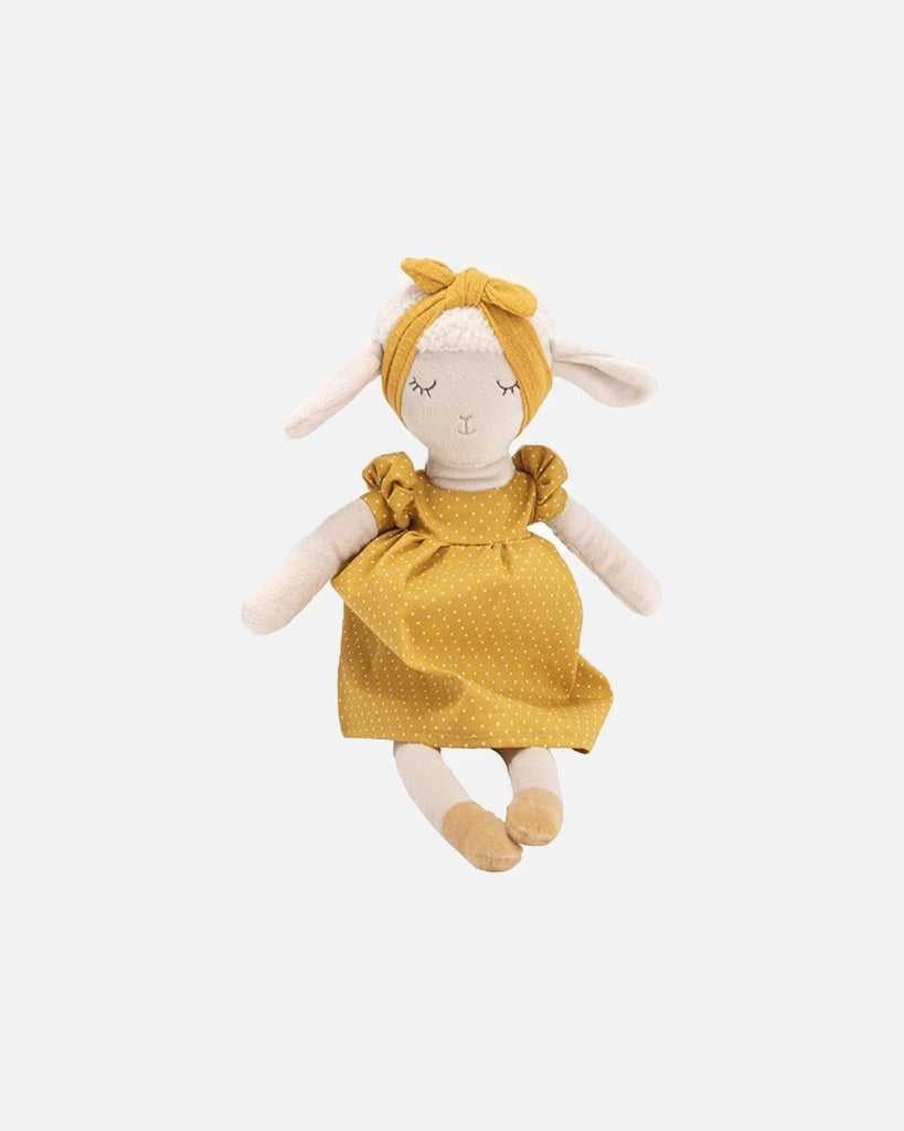 Peluche mouton portant une robe jaune moutarde à pois de la marque Bobine Paris.