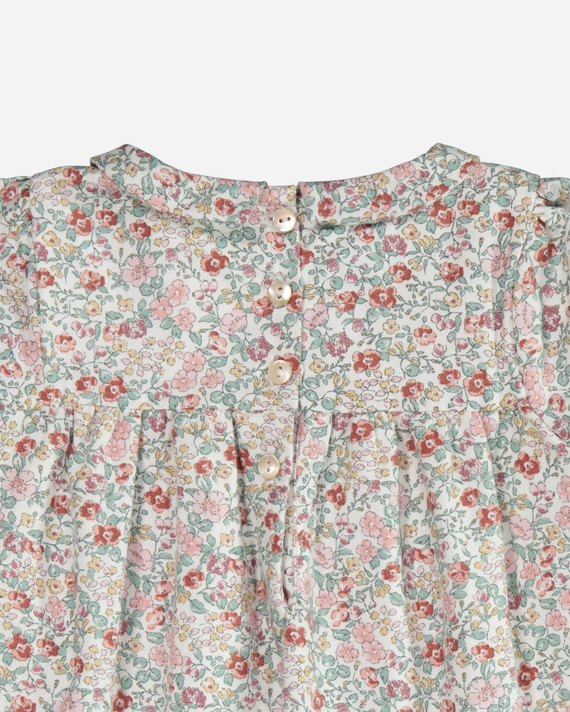 Zoom sur le col de la robe Anna manches courtes fleurie rose et émeraude vue de dos.