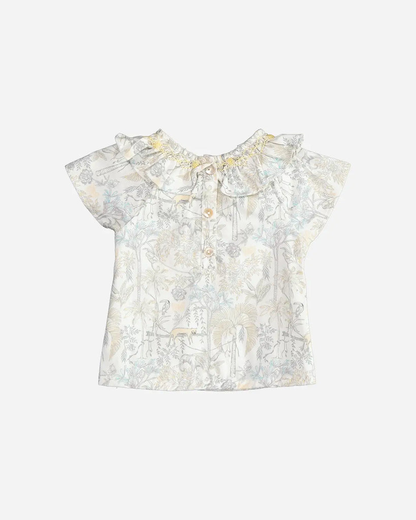 Vue de dos de la blouse pour bébé fille à col volanté, manches courtes et motif savane de la marque Bobine Paris.