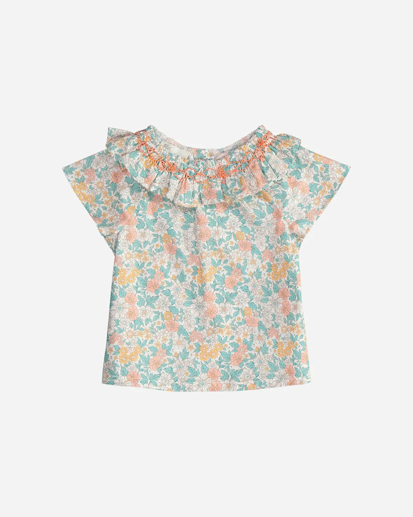 Blouse pour bébé fille à col volanté et motif fleuri couleur amande et corail de la marque Bobine Paris.