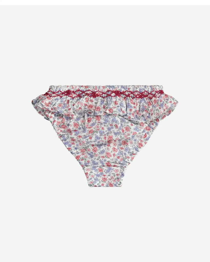 Vue de dos de la culotte de bain à motif fleuri rose et bleu pour bébé fille de la marque Bobine Paris.