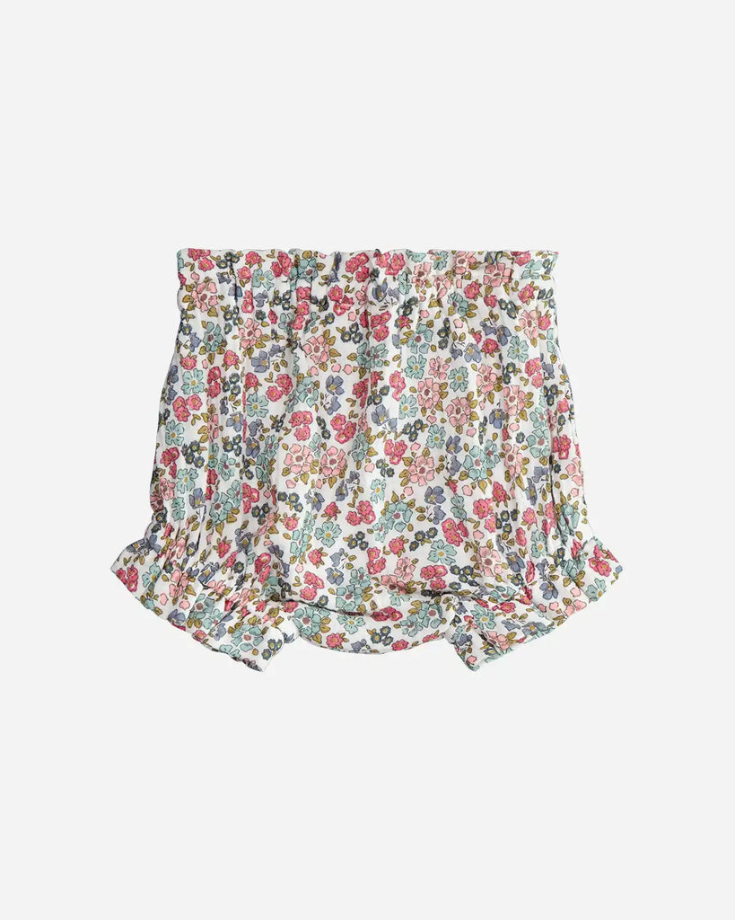 Vue de dos du bloomer pour bébé fille à imprimé fleuri multicolore en gaze de coton de la marque Bobine Paris.