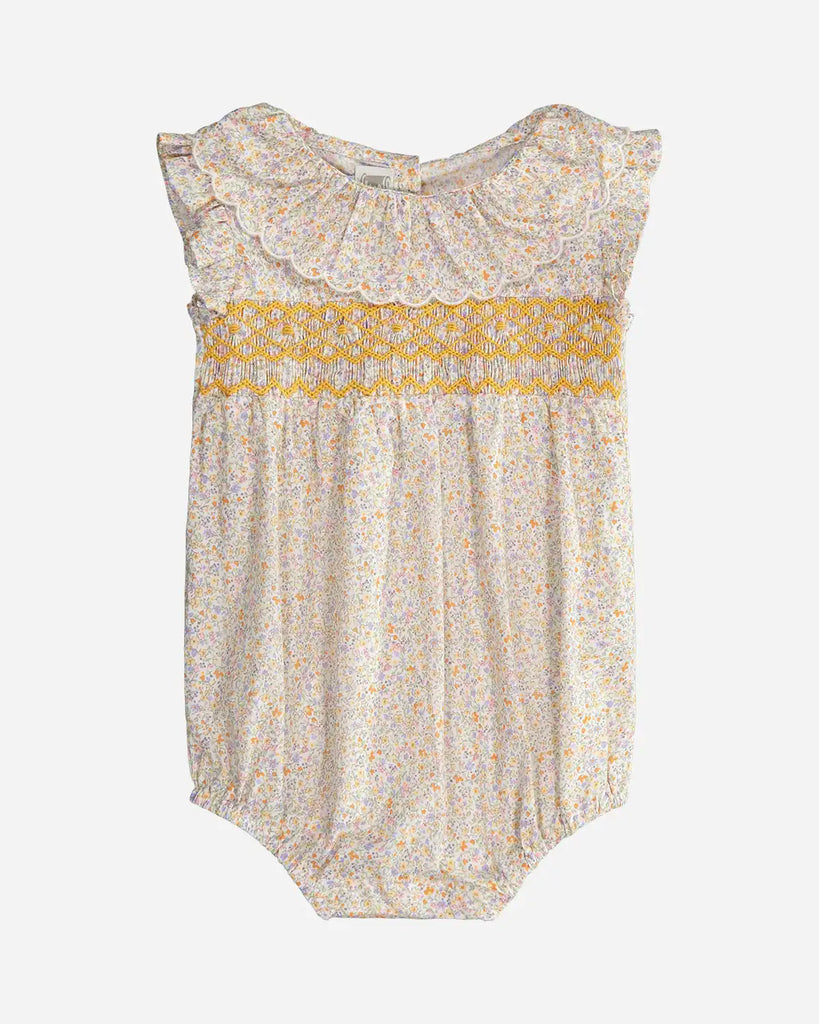Combinaison fleurie jaune pour bébé fille, avec un grand col festonné et de la broderie en fil jaune de la marque Bobine Paris.