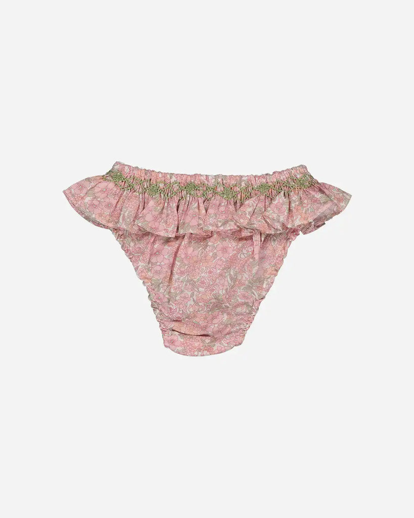 Vue de dos de la culotte de bain à froufrous et motifs fleuris pour bébé fille de la marque Bobine Paris.