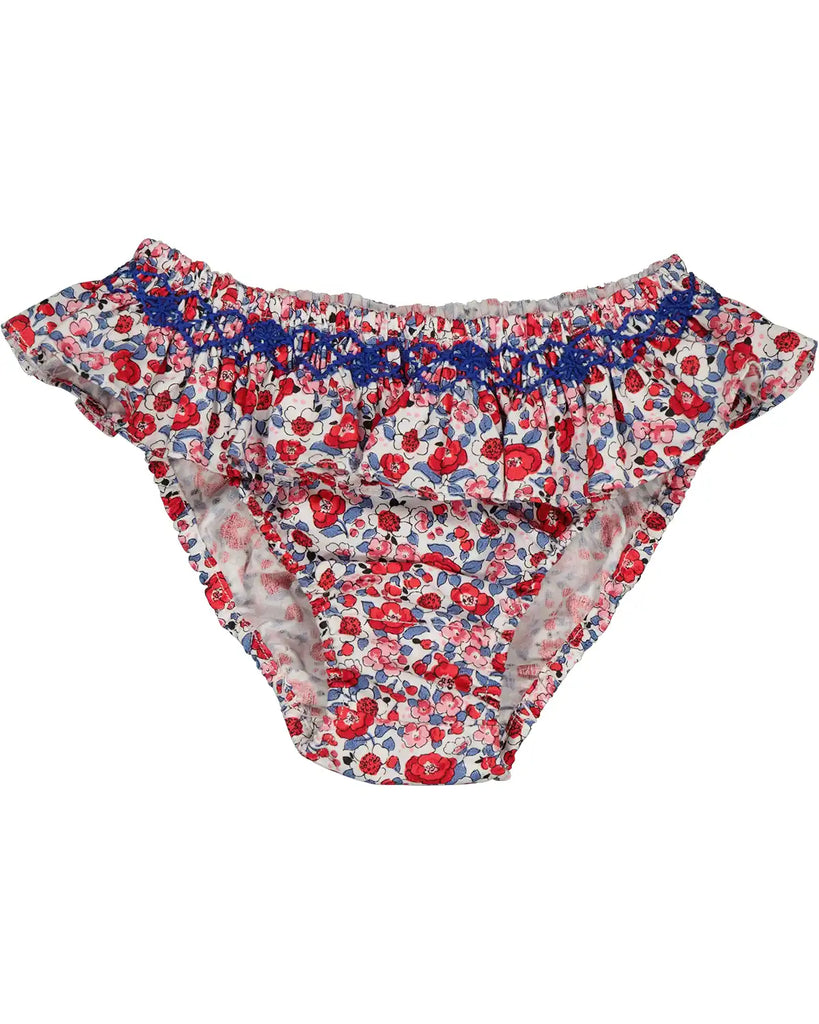Zoom de la culotte de bain bébé fille à froufrous et motifs fleuris rouge de la marque Bobine Paris.