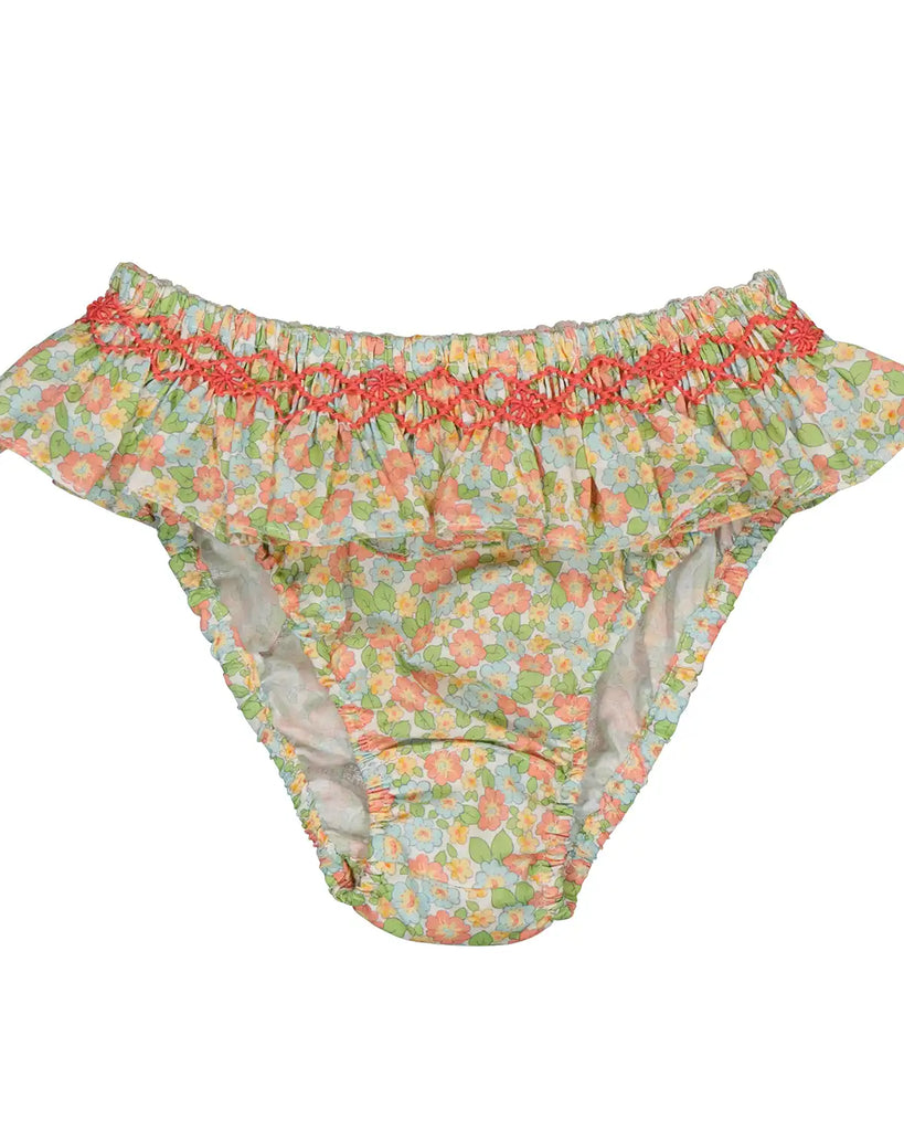Zoom de la culotte de bain à froufrous et motifs fleuris prairie verte pour bébé fille de la marque Bobine Paris.