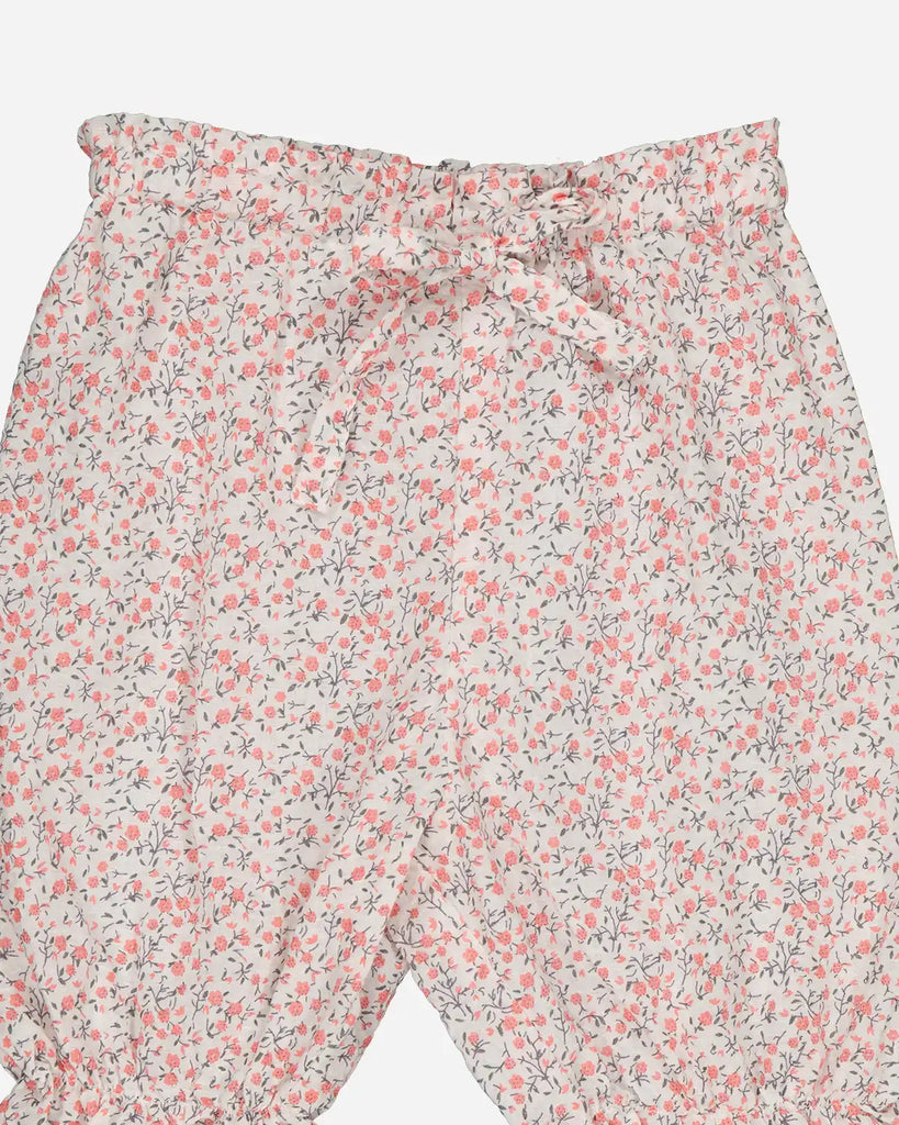 Zoom du panty volanté pour bébé fille à motifs fleurs de cerisier de la marque Bobine Paris.