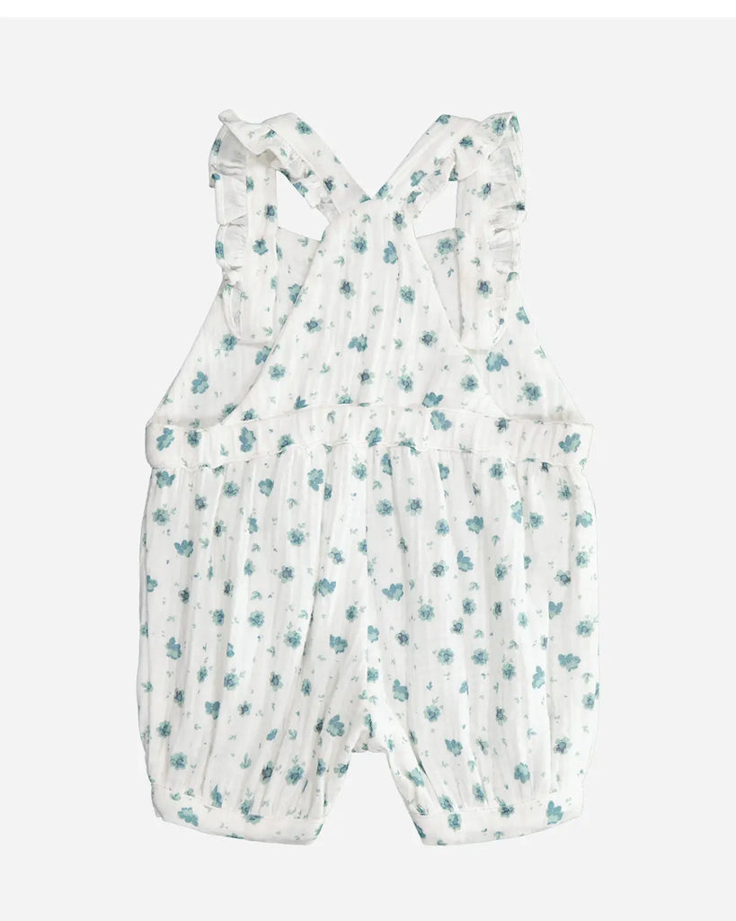 Vue de dos de la salopette pour bébé fille courte blanche à fleurs vert amande en gaze de coton de la marque Bobine Paris.