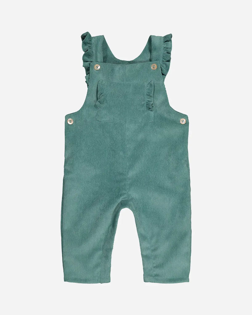 Salopette pour bébé fille vert amande avec bretelles et poches à volants de la marque Bobine Paris.
