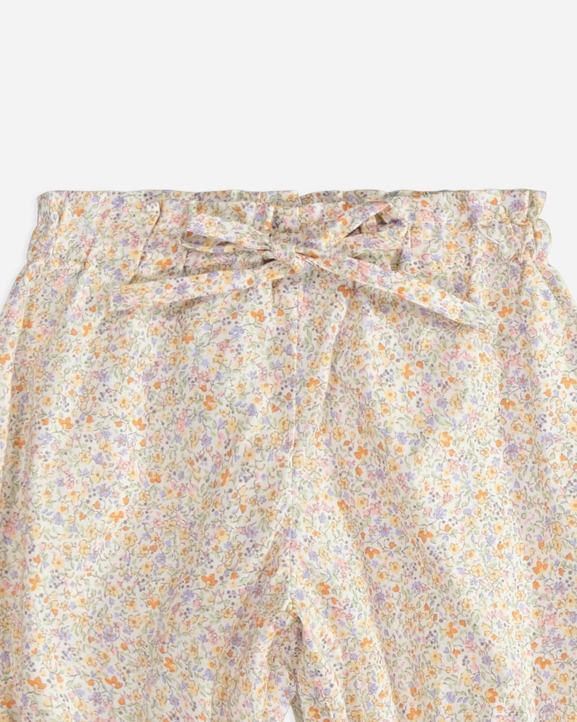 Zoom du panty pour bébé fille à fleurs jaunes de la marque Bobine Paris.