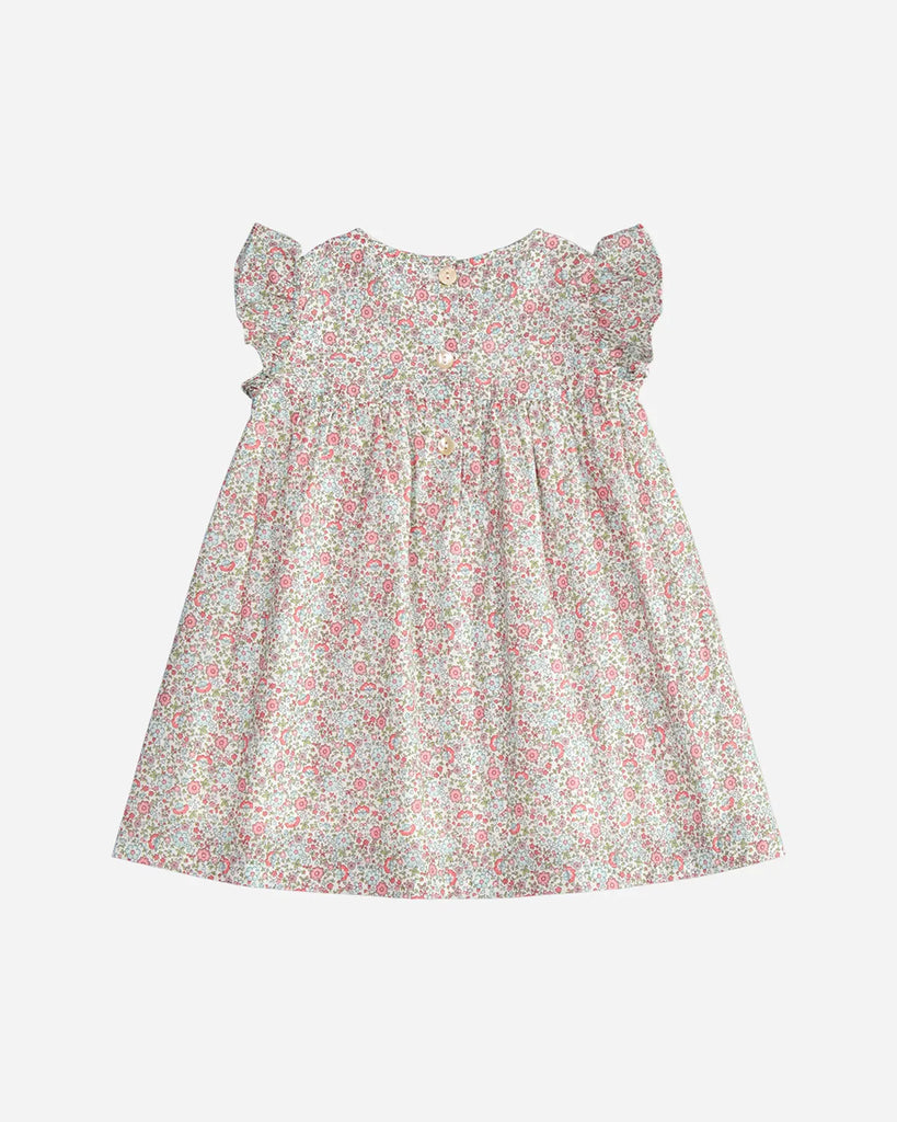 Vue de dos de la robe pour bébé fille à imprimé à fleurs printanières rose de la marque Bobine Paris.