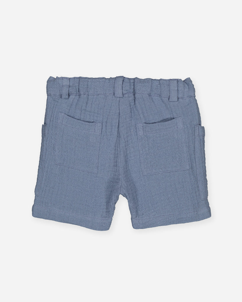 Short pour bébé garçon en gaze de coton couleur bleu jean de la marque Bobine Paris.