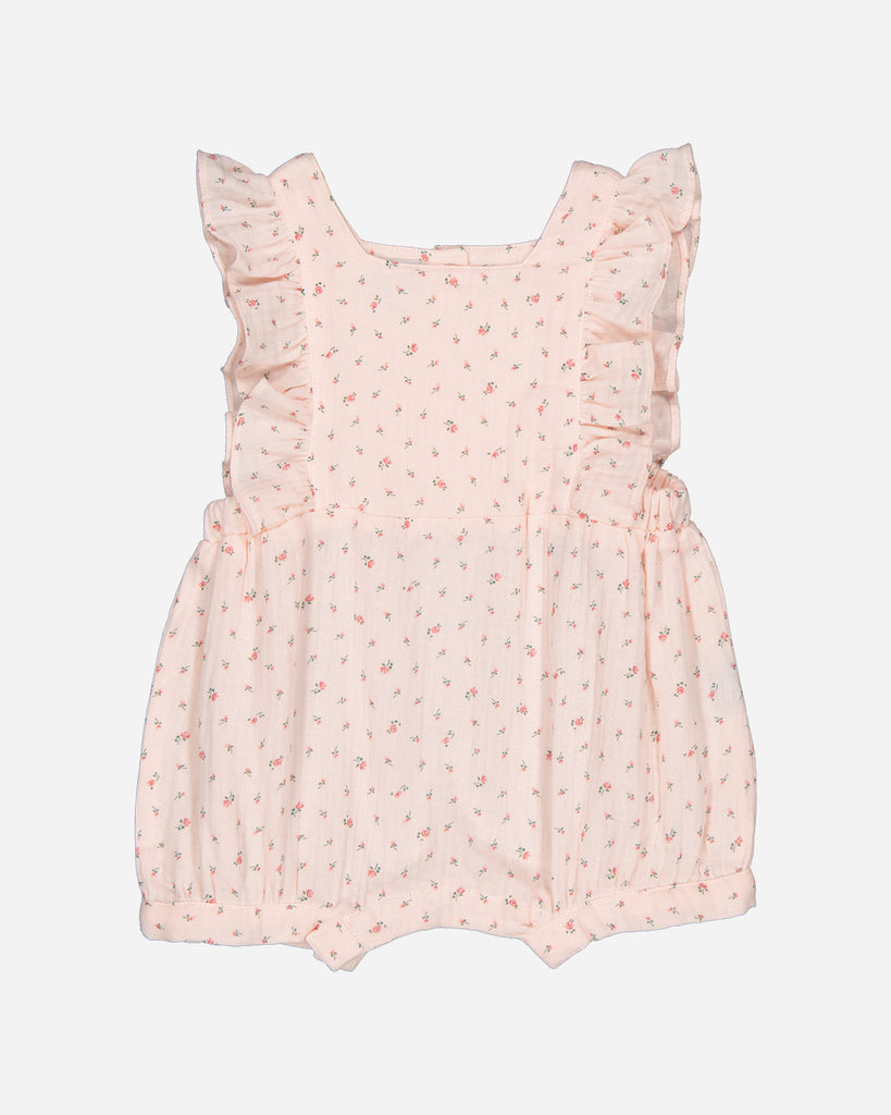 Combinaison pour bébé fille rose à motifs fleuris de la marque Bobine Paris.